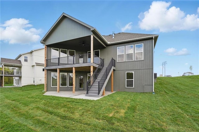 1510 NW 106th Ter, Kansas City, MO 64155 - rear view of house with stairs, a wooden deck, ceiling fan, a patio, and a yard