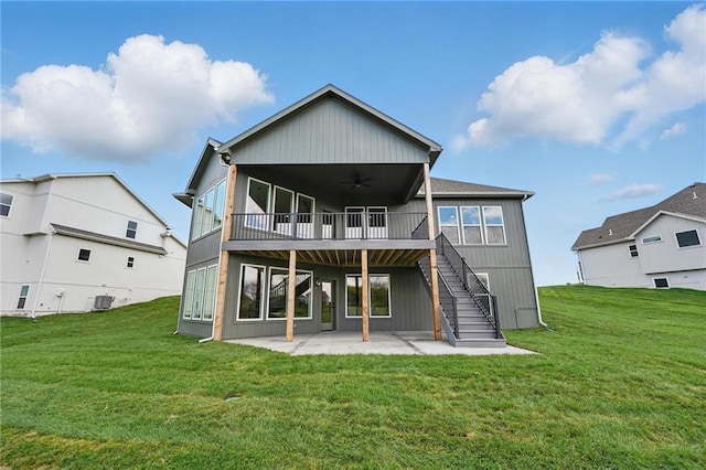 1510 NW 106th Ter, Kansas City, MO 64155 - rear view of house featuring stairs, ceiling fan, central AC unit, a patio area, and a lawn
