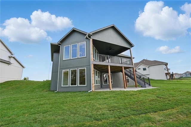 1510 NW 106th Ter, Kansas City, MO 64155 - rear view of house featuring a ceiling fan, a lawn, a deck, stairway, and a patio