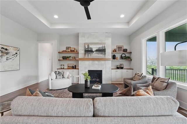 1510 NW 106th Ter, Kansas City, MO 64155 - living room with recessed lighting, a raised ceiling, dark wood finished floors, and a fireplace