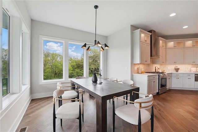 1510 NW 106th Ter, Kansas City, MO 64155 - dining room with a chandelier, light wood-style flooring, recessed lighting, baseboards, and visible vents