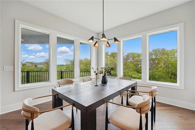 1510 NW 106th Ter, Kansas City, MO 64155 - dining area with an inviting chandelier, baseboards, and plenty of natural light