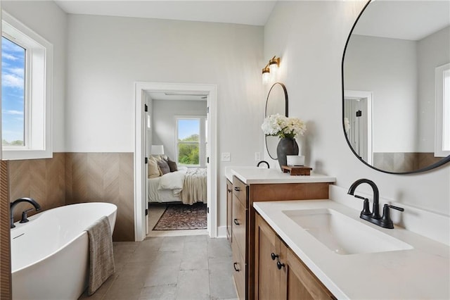 1510 NW 106th Ter, Kansas City, MO 64155 - bathroom featuring ensuite bath, a freestanding bath, and vanity