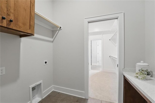 1510 NW 106th Ter, Kansas City, MO 64155 - laundry area with cabinet space, hookup for an electric dryer, and baseboards
