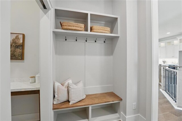 1510 NW 106th Ter, Kansas City, MO 64155 - mudroom with baseboards, recessed lighting, and light wood-style floors