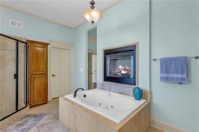 bathroom with visible vents, a stall shower, a whirlpool tub, ornamental molding, and a glass covered fireplace