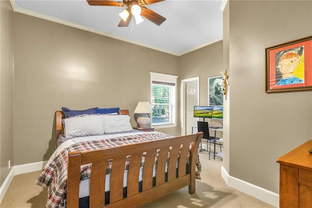 carpeted bedroom with crown molding, a ceiling fan, and baseboards