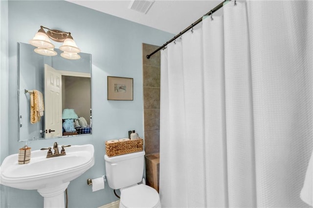 full bath featuring a sink, visible vents, and toilet