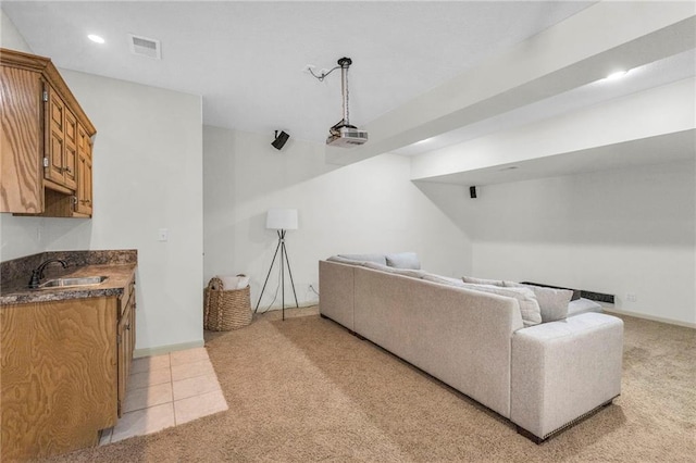 living area featuring recessed lighting, visible vents, light carpet, and baseboards