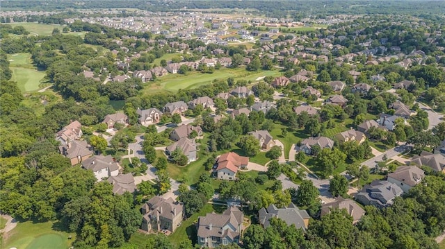 drone / aerial view featuring a residential view and golf course view