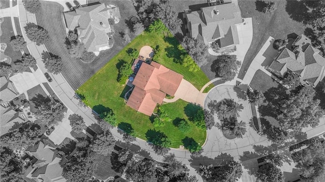 birds eye view of property with a residential view