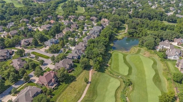 birds eye view of property with a residential view, a water view, and view of golf course