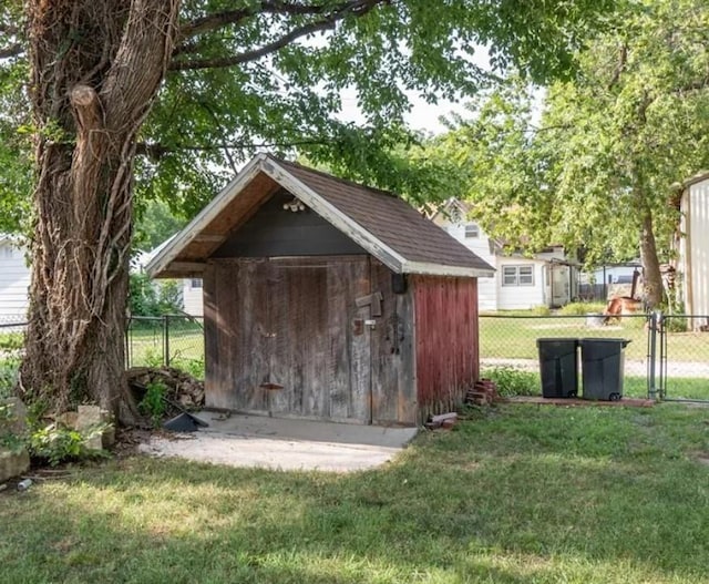 view of shed with fence