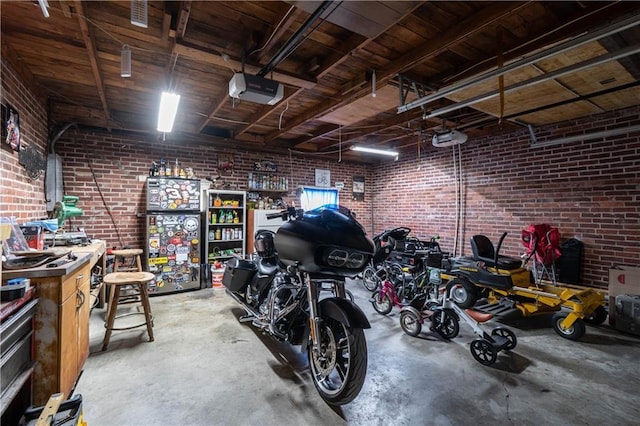 garage with a workshop area and a garage door opener