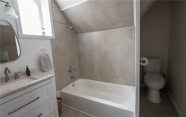 full bathroom with lofted ceiling, toilet, vanity,  shower combination, and tile patterned floors