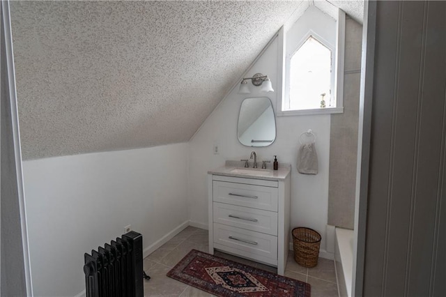 full bath with lofted ceiling, radiator heating unit, tile patterned flooring, a textured ceiling, and vanity