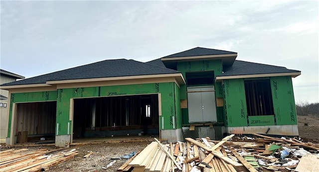 unfinished property with an attached garage