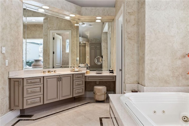 full bathroom featuring marble finish floor, visible vents, vanity, and a whirlpool tub