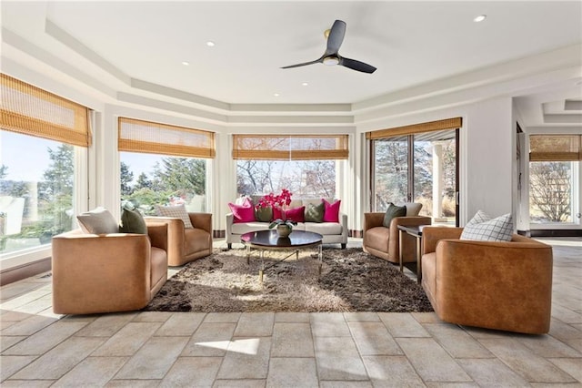 sunroom / solarium featuring ceiling fan