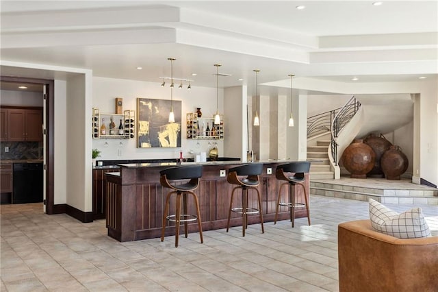 bar featuring pendant lighting, decorative backsplash, wet bar, dishwasher, and stairs