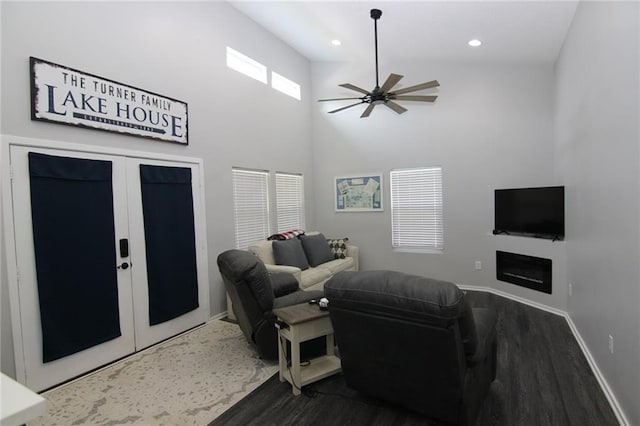 living room featuring a ceiling fan, wood finished floors, baseboards, recessed lighting, and french doors