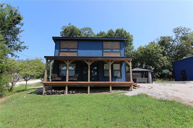 view of front of home with a gazebo and a front yard