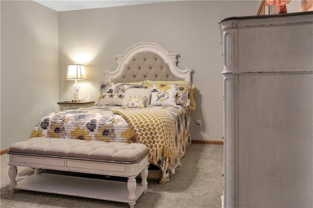 bedroom featuring fridge, carpet flooring, and baseboards