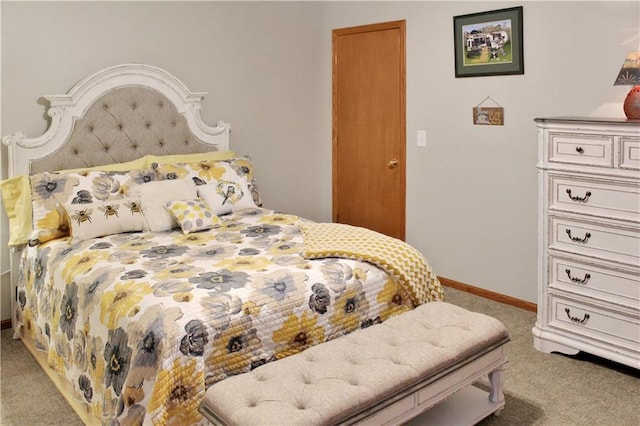 bedroom with carpet flooring and baseboards