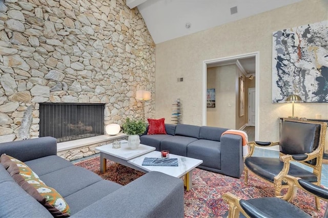 living area with beam ceiling and high vaulted ceiling