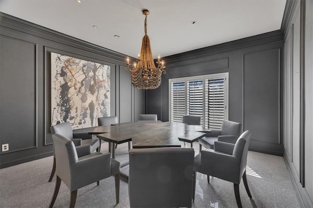 dining space with a decorative wall, carpet flooring, and an inviting chandelier