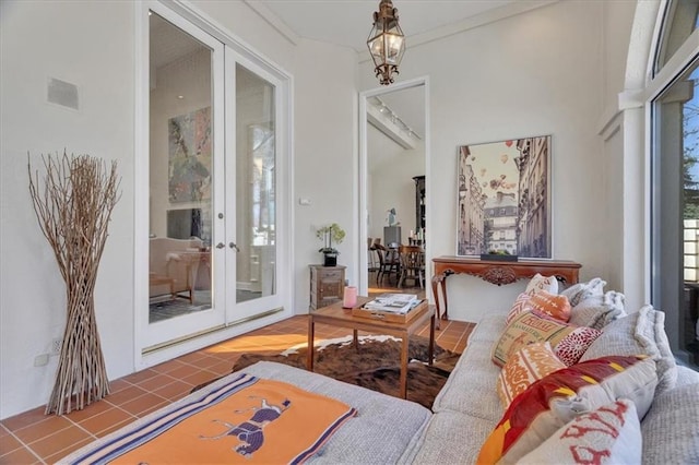 tiled living room with french doors and visible vents