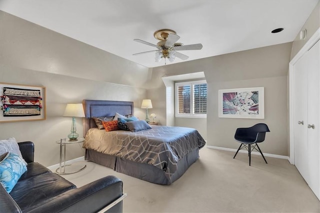 bedroom featuring a ceiling fan, baseboards, and carpet floors