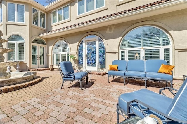 view of patio / terrace with french doors and outdoor lounge area