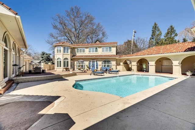 pool with a patio area