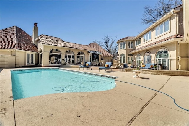 pool with a patio