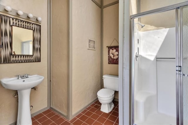 bathroom with tile patterned floors, visible vents, toilet, and a shower stall