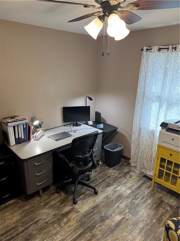 office area with a ceiling fan and wood finished floors