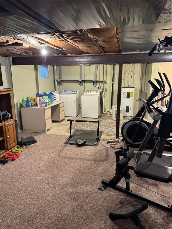 interior space with water heater and separate washer and dryer