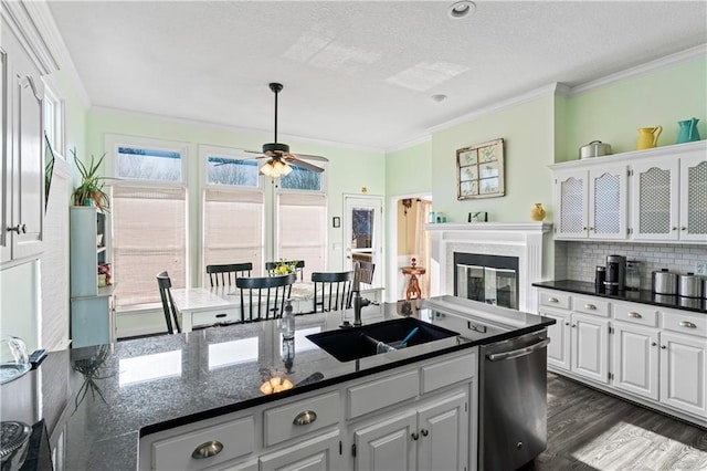 kitchen featuring dark wood-style flooring, white cabinetry, ornamental molding, dishwasher, and tasteful backsplash