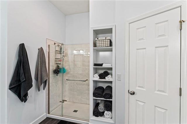 full bathroom featuring tiled shower