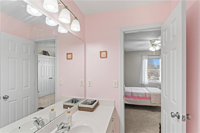 ensuite bathroom featuring ensuite bathroom, vanity, and a ceiling fan