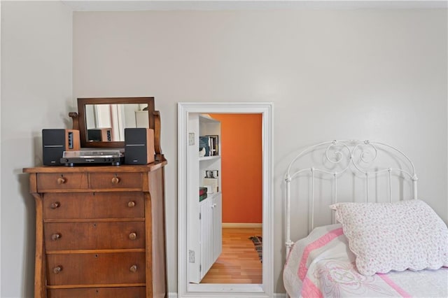 bedroom featuring wood finished floors