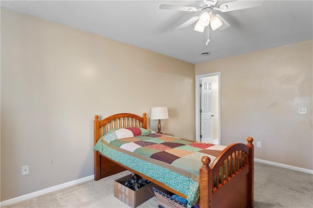 bedroom featuring carpet floors, ceiling fan, and baseboards