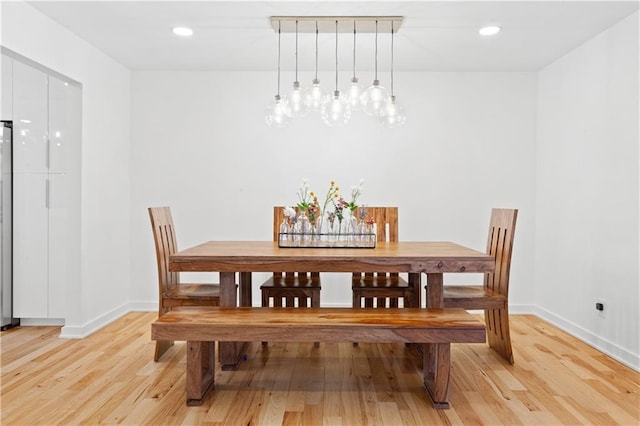 dining room featuring a chandelier, recessed lighting, light wood-style flooring, and baseboards