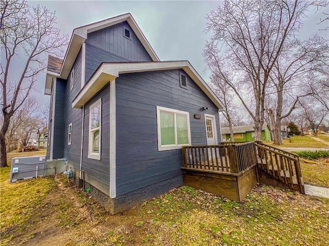 view of side of property with a deck