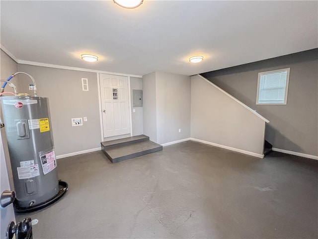 finished below grade area featuring electric panel, baseboards, and electric water heater