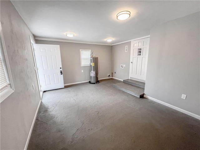 entryway with baseboards and electric water heater