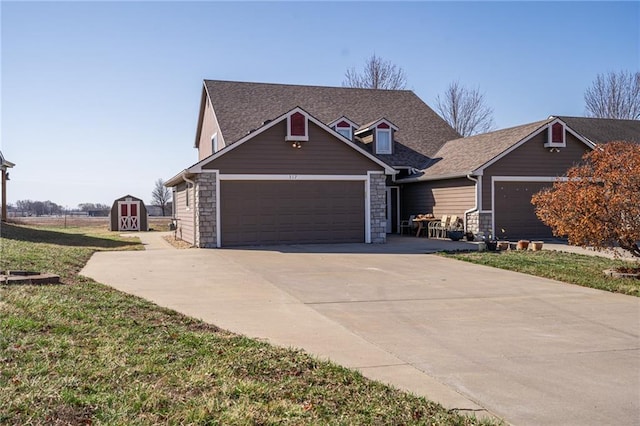 view of front of house with an attached garage, driveway, and roof with shingles