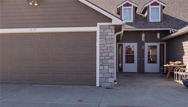 garage featuring driveway