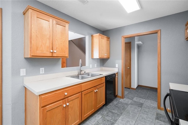 kitchen featuring dishwasher, light countertops, stove, and a sink